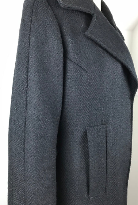 sleeve detail of black herringbone winter coat